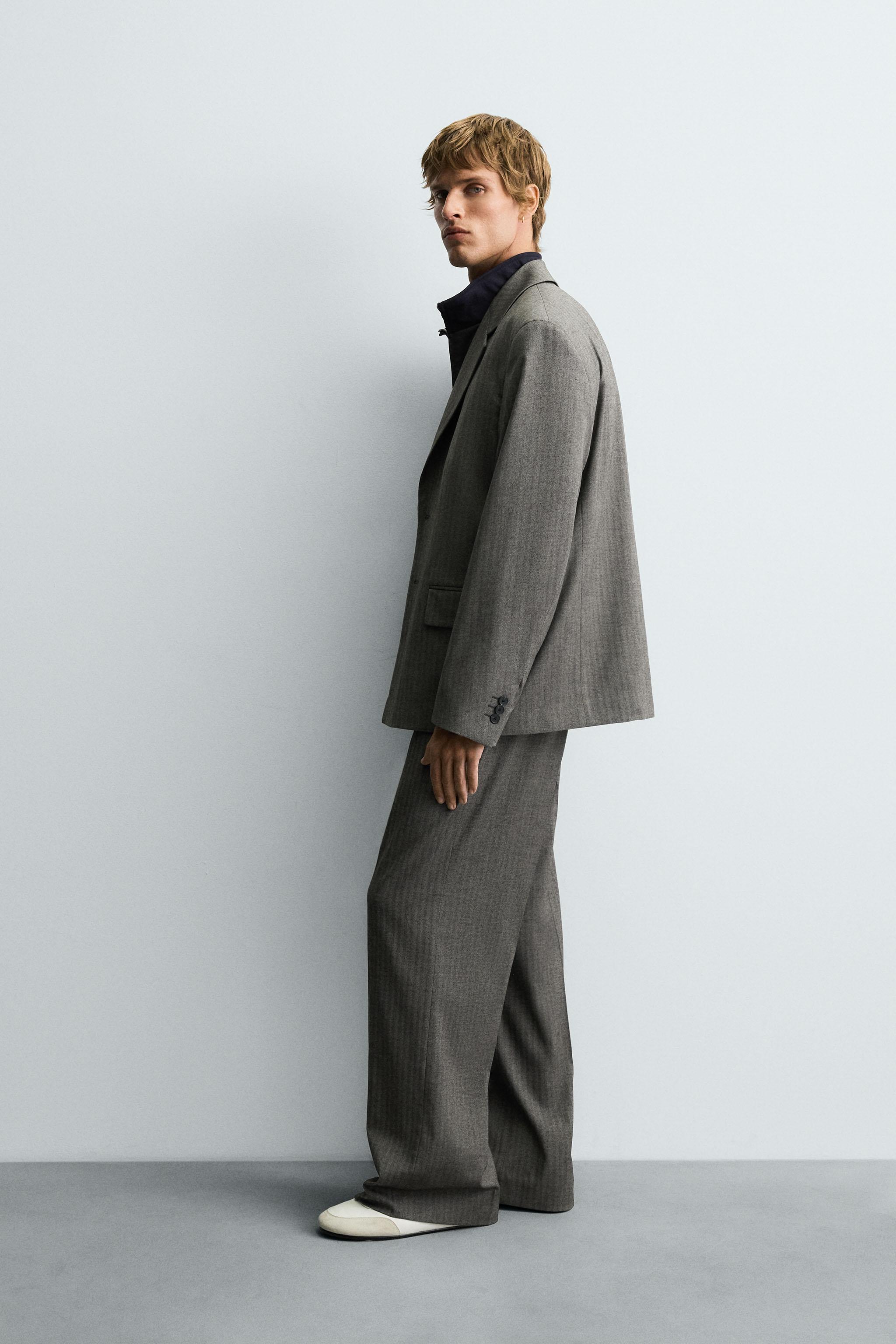 HERRINGBONE SUIT FLARE FIT PANTS